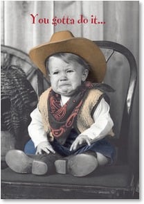 Crying baby in cowboy gear