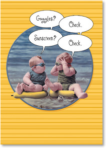 2 baby boys on beach wearing swim goggles