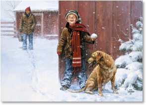 Boy hiding next to barn with snowball