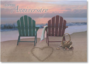 Adirondack chairs and heart drawn  in sand