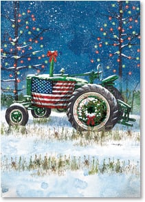 Green tractor in snow with American flag