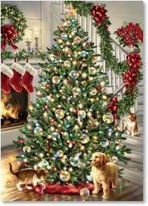 Puppy and kitten next to Christmas tree and fireplace