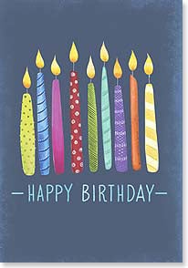 Various colored candles on navy blue background