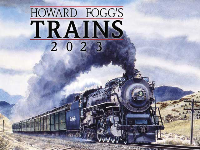 a large train going down a railroad track
