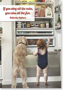 Photo of baby and dog looking in fridge