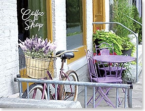 BIKE OUTSIDE COFFEE SHOP WITH FLOWER BASKET