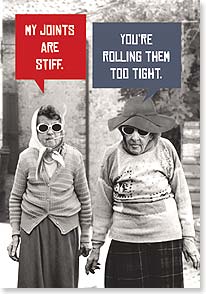 a photograph of two senior women walking and one has a joint in her mouth