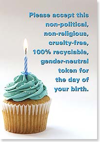 a cupcake with teal frosting and a single candle