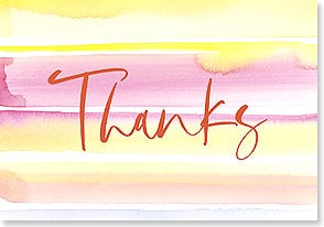 the word thanks in a cursive scrawl on top of pretty painted colors