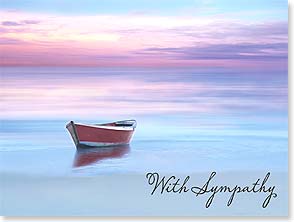 Red boat on water with pink clouds