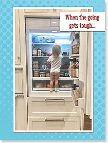 Rear of little girl in refrigerator