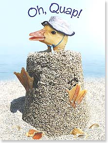 Duck wearing hat stuck in sandcastle