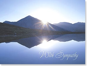 Sunset over mountains and lake