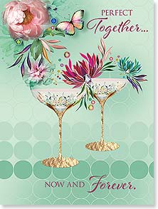 PAIR OF COCKTAIL GLASSES ON TEAL BACKGROUND