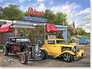 ROUTE 66 DINER WITH HOT RODS in parking lot