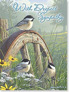 Chickadees perched on wagon wheel