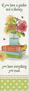 MASON JAR WITH FLOWERS ON STACK OF BOOK