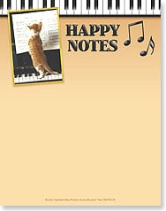 Cat reading sheet music at piano