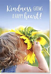 GIRL SMELLING GIANT SUNFLOWER