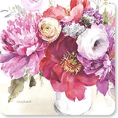 a bouquet of pink and red flowers in a white vase