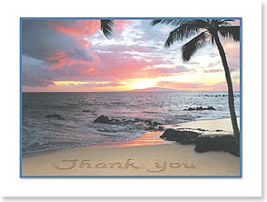 Thank you written in sand on beach