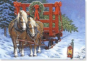 Pair of draft horses with sled of tree