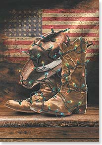 Old cowboy boots and hat decorated with Christmas lights