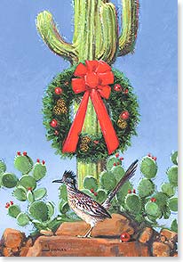 ROADRUNNER WITH CHRISTMAS WREATH HANGING ON A CACTUS