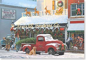 Vintage red truck parked in front of Route 66 hardware store in snow