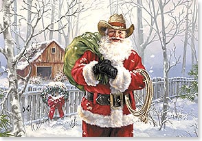 cowboy santa with lasso and gifts in front of snowy cabin