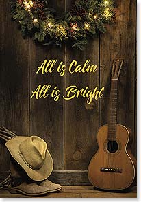 photo of guitar and cowboy hat and boots next to wreath with lights on wood wall