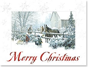 Horses standing in snow by fence with barn in background