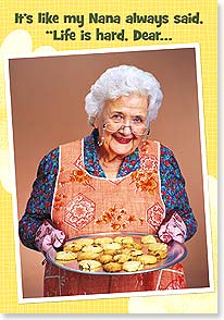 ELDERLY WOMAN HOLDING TRAY OF COOKIES