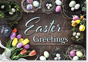 a bouquet of tulips and many nests full of easter eggs on a wood table