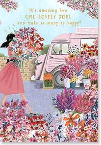 a woman carries a large bouquet of flowers towards a pink florists van