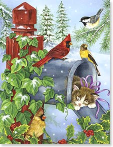 Kitten sleeping in mailbox with holly and birds around