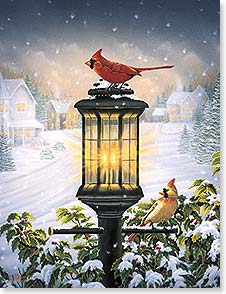 Two cardinals on a lamp post