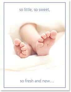 Pair of baby feet on white blanket